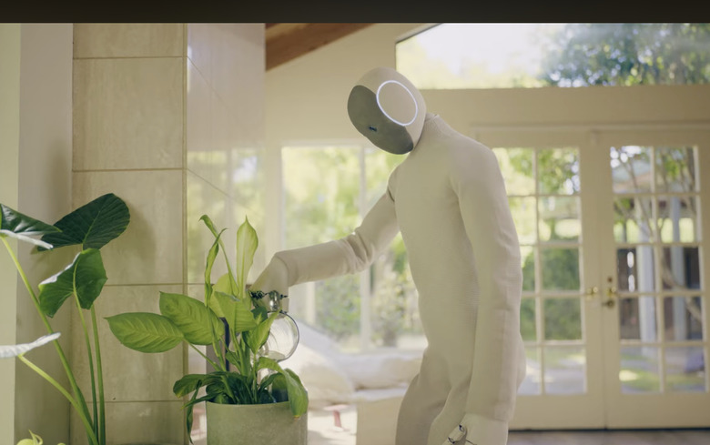 A robot watering plants.