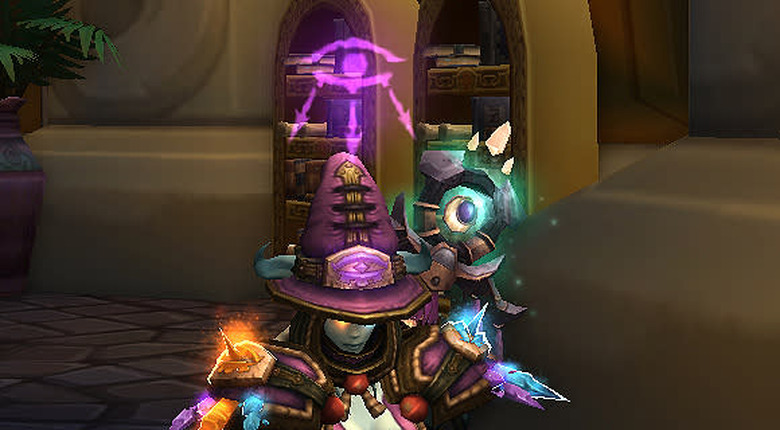 A mage sitting wearing mage challenge mode gear with an arcane eye projected over her head