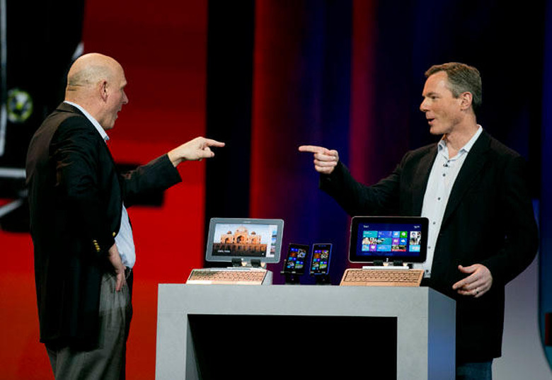Paul Jacobs, chief executive officer of Qualcomm Inc., right, and Steve Ballmer, chief executive officer of Microsoft Corp., gesture towards each other during a keynote speech at the 2013 Consumer Electronics Show in Las Vegas, Nevada, U.S., on Monday, Jan. 7, 2013. The 2013 CES trade show, which runs until Jan. 11, is the world's largest annual innovation event that offers an array of entrepreneur focused exhibits, events and conference sessions for technology entrepreneurs. Photographer: Andrew Harrer/Bloomberg via Getty Images