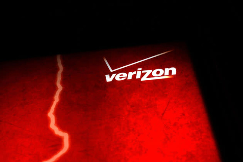 NEW YORK, NY - JUNE 07: A Verizon advertisement is viewed outside of a store on June 7, 2013 in New York City. In a statement today U.S. President Barack Obama defended the government's surveillance programs following a news leak on June 5 that the U.S. government had been obtaining Verizon's phone records for years. The records were obtained through a secret court order which also revealed that the government has been monitoring business phone calls both nationally and internationally. (Photo by Spencer Platt/Getty Images)