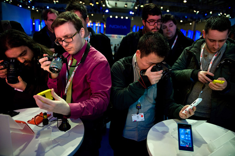 BARCELONA, SPAIN - FEBRUARY 25: Visitors take pictures of a new Nokia device during the first day of the Mobile World Congress 2013 at the Fira Gran Via complex on February 25, 2013 in Barcelona, Spain. The annual Mobile World Congress hosts some of the world's largest communication companies, with many unveiling their latest phones and gadgets. The show runs from February 25 - February 28. (Photo by David Ramos/Getty Images)