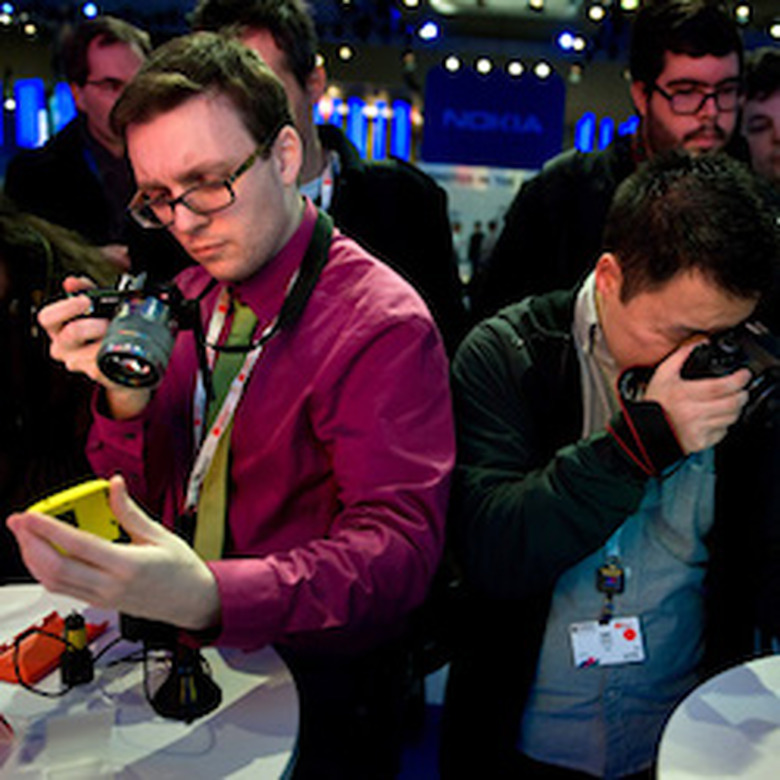 BARCELONA, SPAIN - FEBRUARY 25: Visitors take pictures of a new Nokia device during the first day of the Mobile World Congress 2013 at the Fira Gran Via complex on February 25, 2013 in Barcelona, Spain. The annual Mobile World Congress hosts some of the world's largest communication companies, with many unveiling their latest phones and gadgets. The show runs from February 25 - February 28. (Photo by David Ramos/Getty Images)