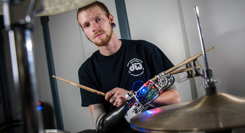 Jason Barnes wearing Georgia Tech's robotic drummer arm