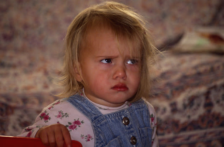 AHB0E1 Child with angry grumpy face. Image shot 2004. Exact date unknown.