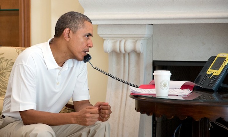 President Barack Obama talks on the telephone with President Francois Hollande of France to discuss the situation in Ukraine, in Key Largo, Florida, March 8, 2014. (Official White House Photo by Pete Souza) 