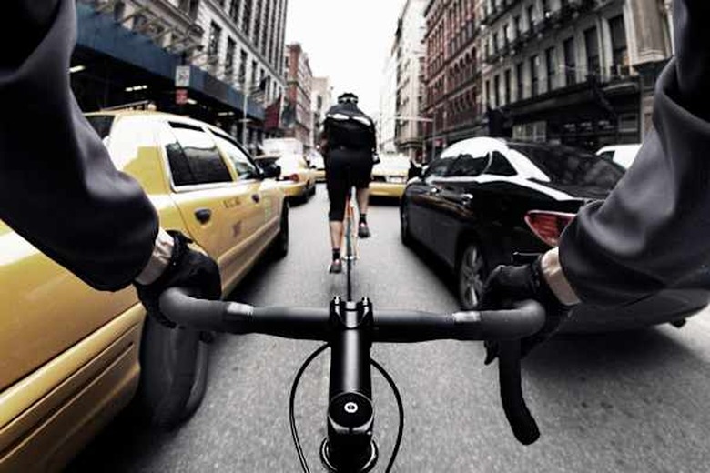 The handlebar view of a bike courier in New York City.