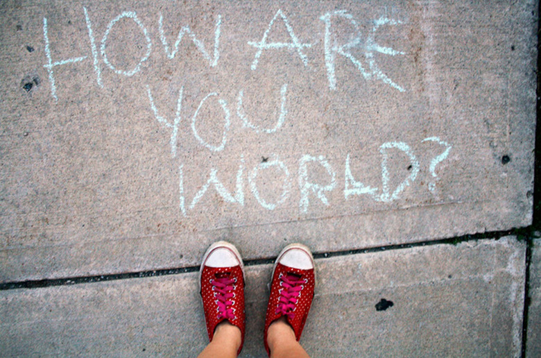 A chalk greeting on the sidewalk