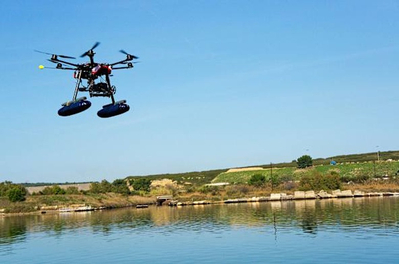 Drone or Unmanned Aerial Vehicle (UAV) used for photography / filming flying by canal de Caronte, Martigues, France