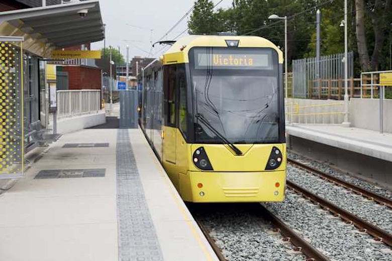 'Manchester Metrolink tram at Chorlton station on the newly opened South Manchester extension, departing for Manchester Victoria