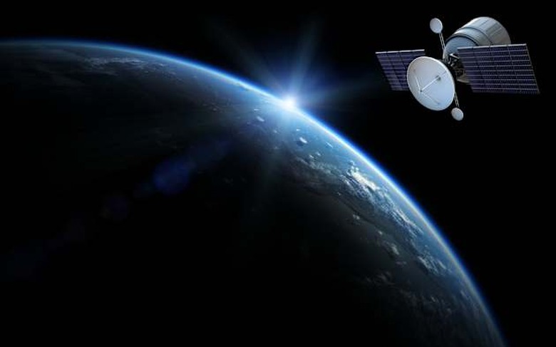 Communication satellite in orbit above planet earth