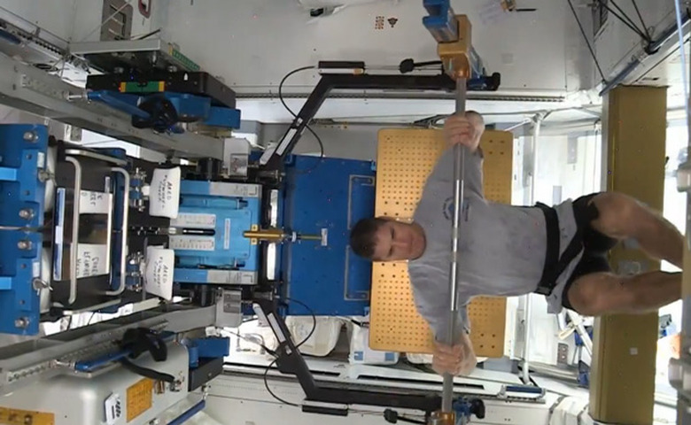 Astronaut weightlifting on the ISS