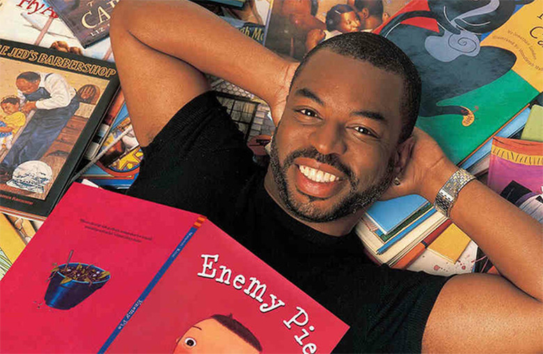 LeVar Burton on a stack o' books