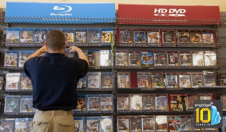 Blockbuster manager Christopher Borghese arranges discs in t