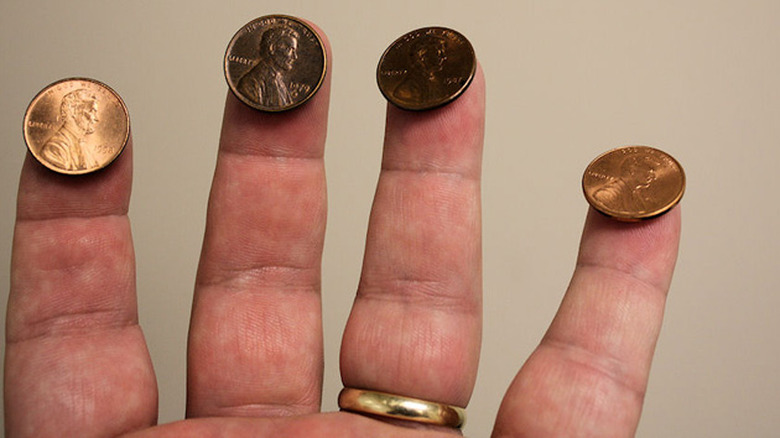 Balancing pennies on fingers