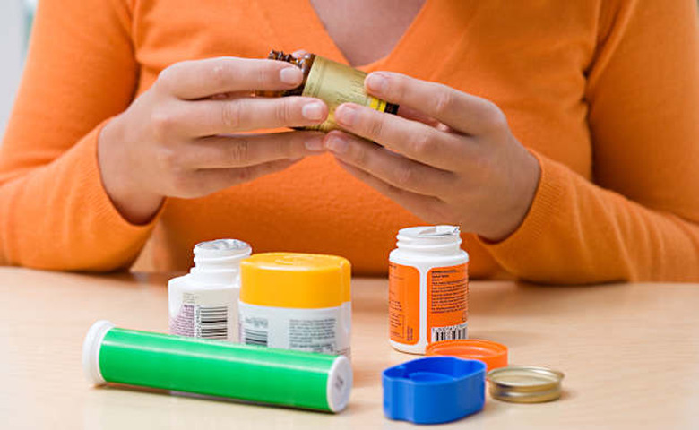 Woman with vitamins and supplements