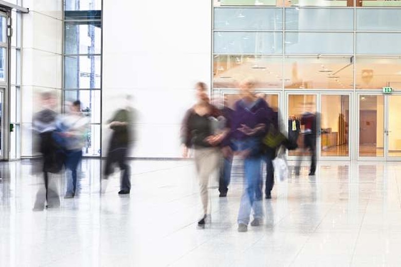 Blurred People Walking in Modern Interior