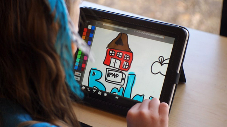 Schoolgirl using an iPad