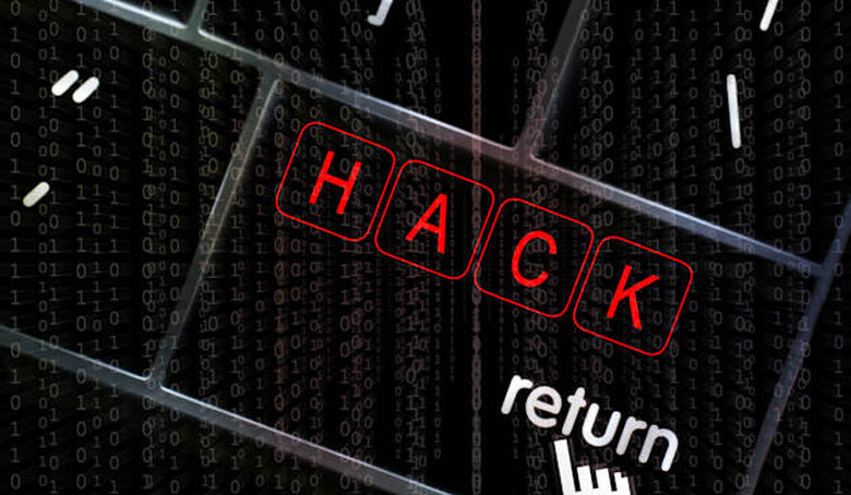 Hack concept with the focus on the return button overlaid with binary code