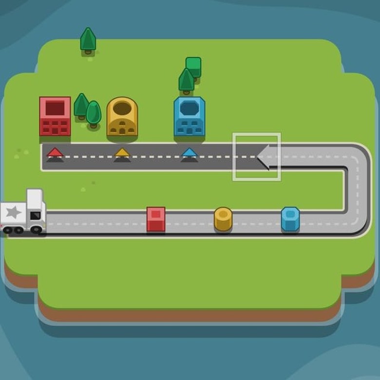 Players route a white truck toward colored blocks to be dropped off at houses in RGB Express
