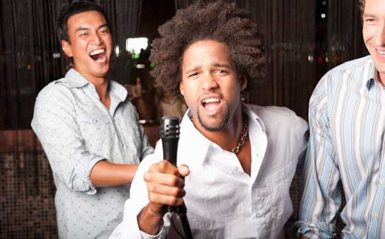 Friends singing out at a club