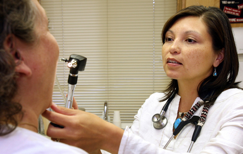 A doctor checks on a patient