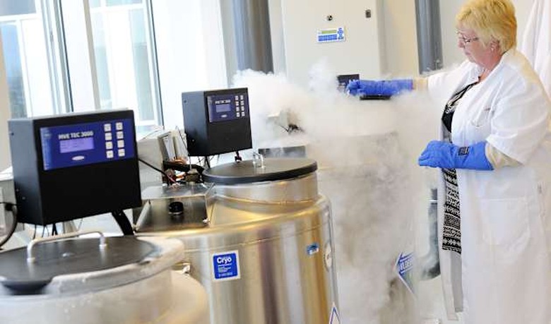 A technician opens a vessel containing w