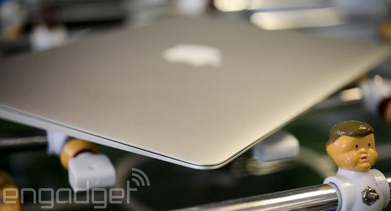 MacBook Air on a foosball table