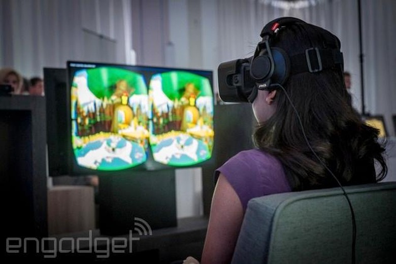 Attendees check out Oculus VR's DK2 headset.