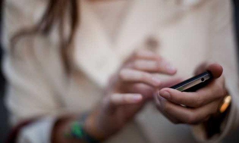 Close-up of a lady using her smartphone.