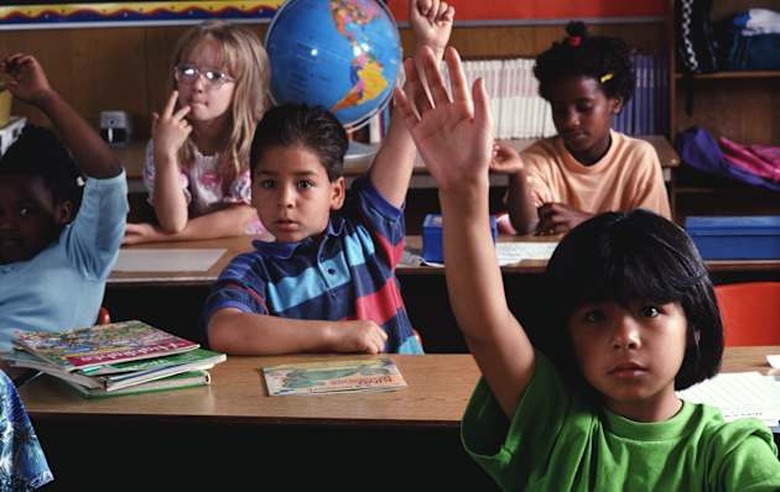 Arizona - Children raising their hands, education,color,horizontal,Arizona,children,boy,girl,African-American,Caucasian,raising,