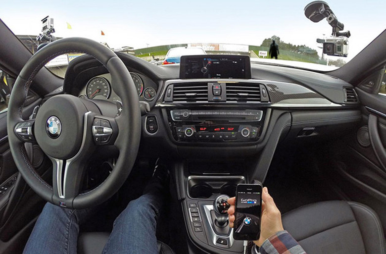 BMW driver recording a trip with a GoPro