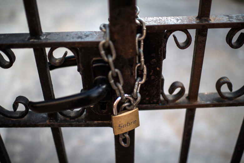 Padlock keeping a gate shut