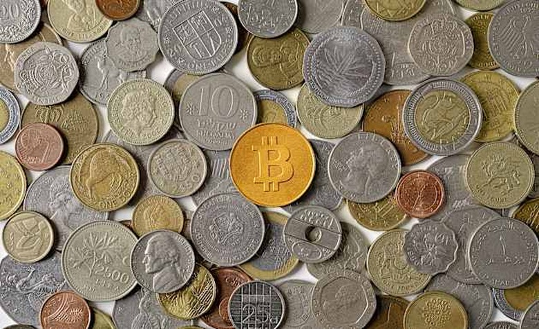 Bitcoin surrounded by various world coins