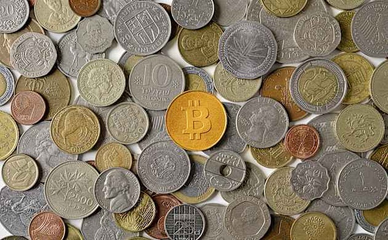 Bitcoin surrounded by various world coins