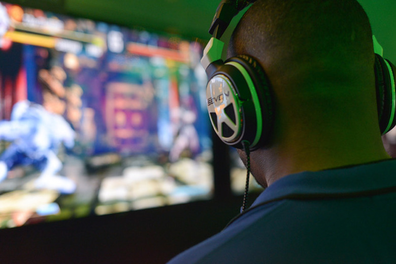 Gamer uses a headset while playing Street Fighter