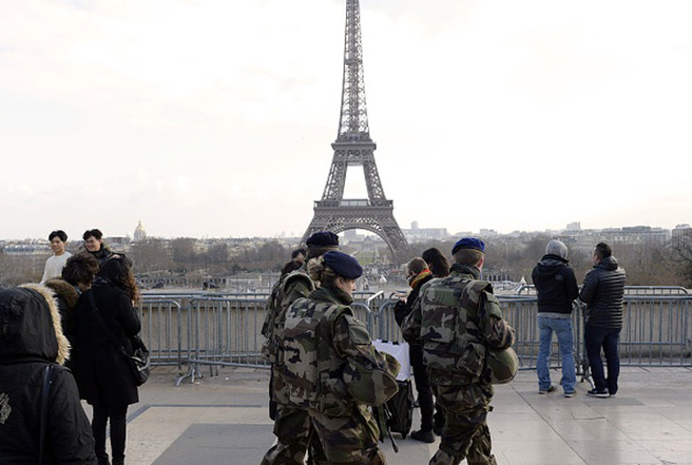 Soldiers patrol near the Eiffel Tower