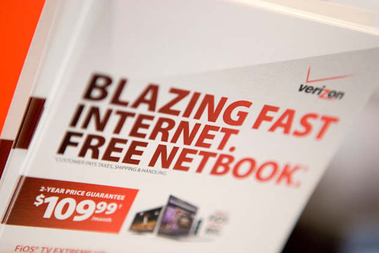 Brochures for Verizon FiOS and a free netbook sit inside a V