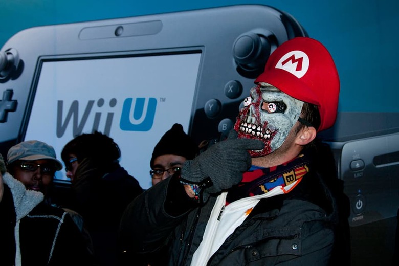 London, UK. 30/11/12.A gamer dressed up as a character from the Super Mario Bros who has been camping outside HMV since Saturday
