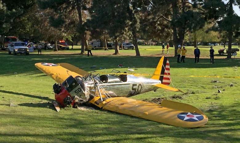 APTOPIX Golf Course Plane Crash