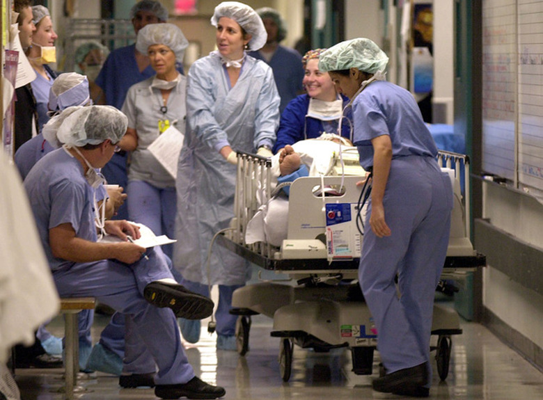 Nurses transporting a patient