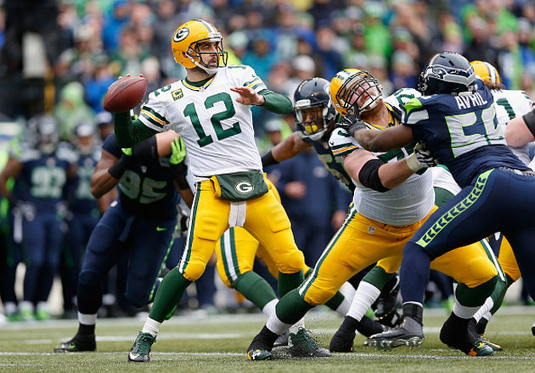 Green Bay's QB gets ready to toss as Seattle closes in