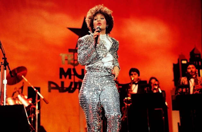 SELENA QUINTANILLA, female vocalist of the Year for 1987, singing on stage during the Seventh Annual Tejano Music Awards (3/23/8