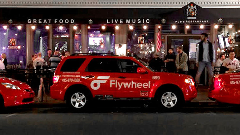 A Flywheel-branded taxi