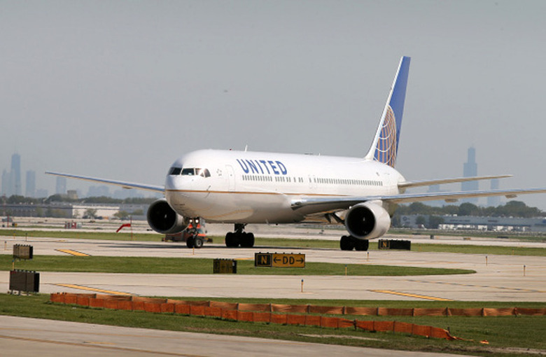 A United Airlines jet taxis on the runway