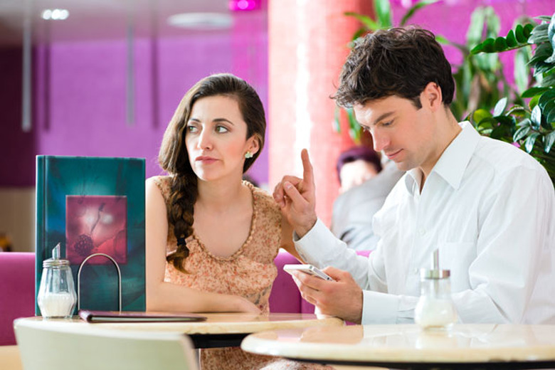 A man distracted by his smartphone
