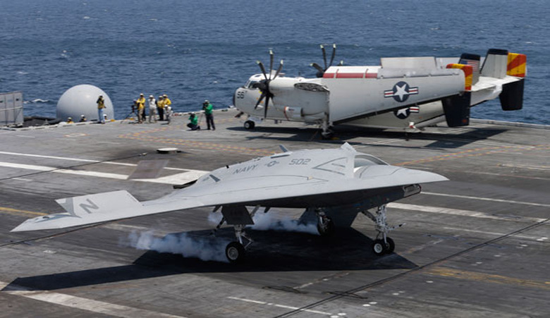An X-47B drone lands on a Navy aircraft carrier