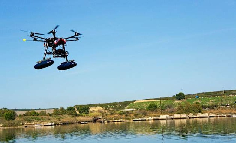 Drone or Unmanned Aerial Vehicle (UAV) used for photography / filming flying by canal de Caronte, Martigues, France