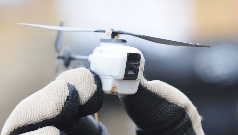 A Black Hornet nano helicopter unmanned aerial vehicle (UAV). The Black Hornet Nano Unmanned Air Vehicle measures around 4 inches by 1 inch (10cm x 2.5cm) and provides troops on the ground with vital situational awareness. The Black Hornet is equipped with a tiny camera which gives troops reliable full-motion video and still images. Soldiers are using it to peer around corners or over walls and other obstacles to identify any hidden dangers and the images are displayed on a handheld terminal. 