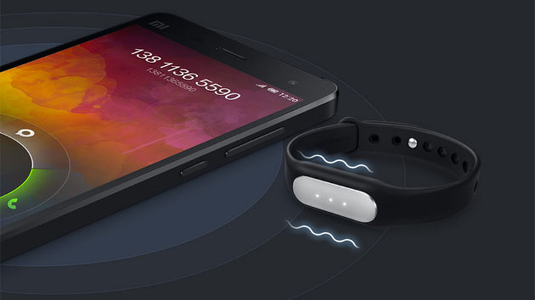 Xiaomi Mi Band next to an Mi4