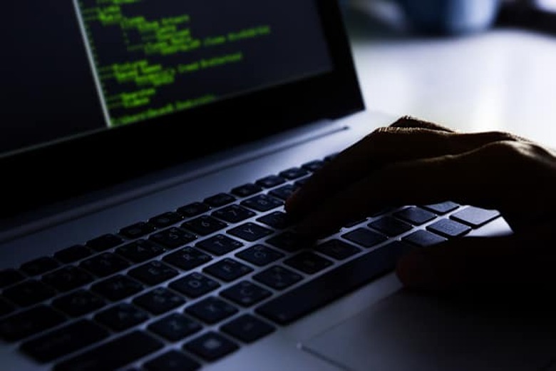 hacker using laptop.